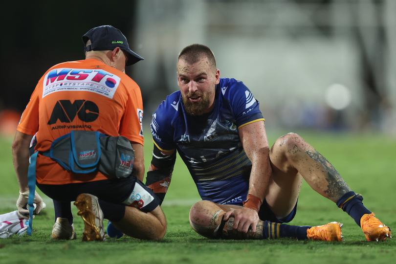DARWIN, AUSTRALIA - APRIL 19: Clint Gutherson of the Eels is attended to by a trainer after an injury during the round seven NRL match between Parramatta Eels and Dolphins at TIO Stadium on April 19, 2024, in Darwin, Australia. (Photo by Mark Metcalfe/Getty Images)