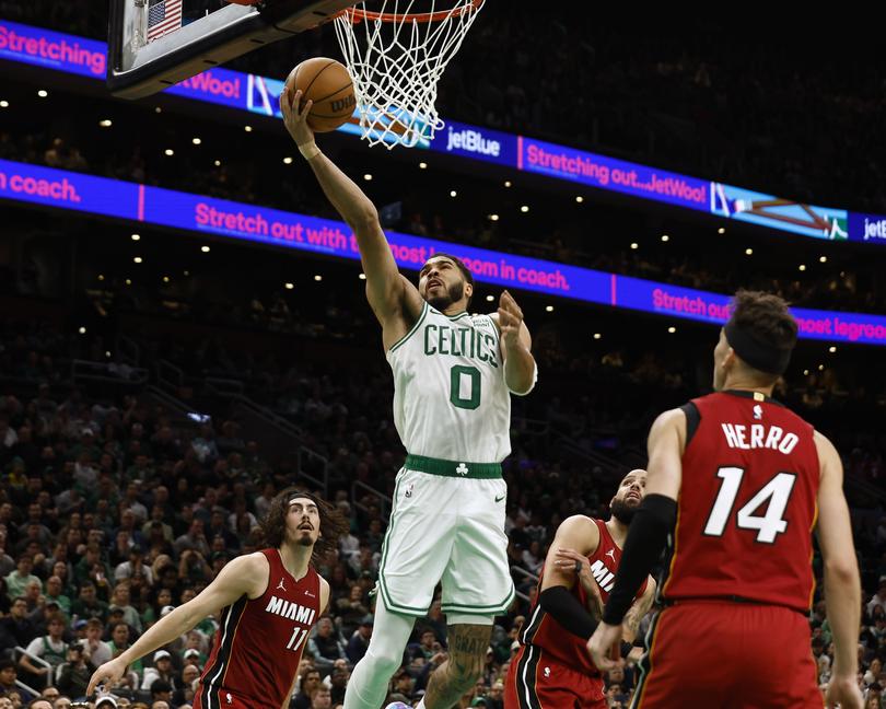 Jayson Tatum goes to the basket against the Miami Heat.