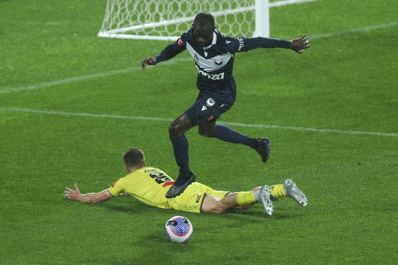 WELLINGTON, NEW ZEALAND - APRIL 12: Jason Geria of the Victory tackles Ben Old of the Phoenix in the box during the A-League Men round 24 match between Wellington Phoenix and Melbourne Victory at Sky Stadium, on April 12, 2024, in Wellington, New Zealand. (Photo by Hagen Hopkins/Getty Images)