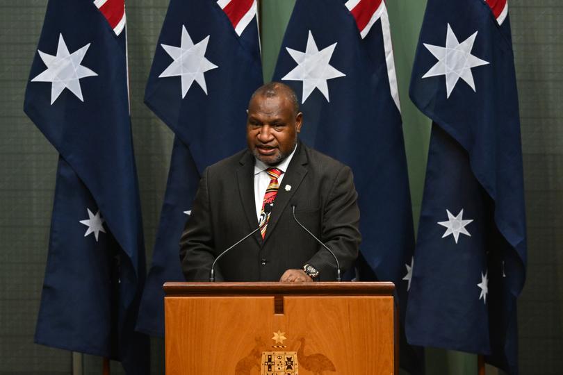 Papua New Guinea Prime Minister James Marape addresses Members and Senators in the House of Representatives at Parliament House in Canberra, Thursday, February 8, 2024. (AAP Image/Lukas Coch) NO ARCHIVING