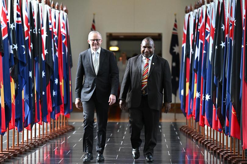 Australian Prime Minister Anthony Albanese walks with Papua New Guinea Prime Minister James Marape. 