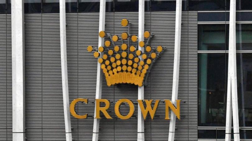 Crown will keep the licence for its luxury Sydney casino after it was declared a 'changed business'.