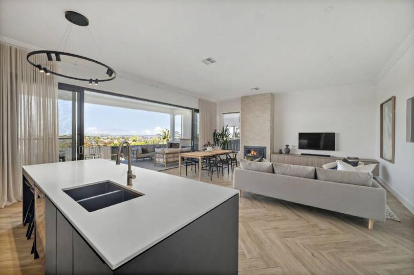 Herringbone wood-look tiles are a feature in the living space