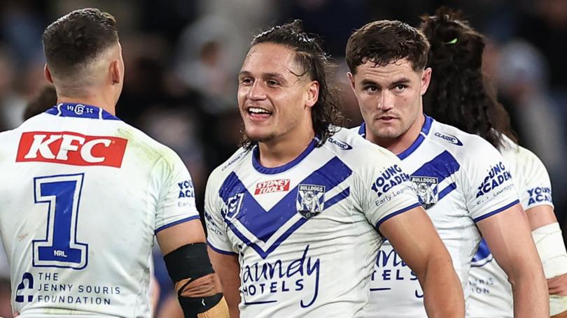 Jackson Topine, centre,  is suing Canterbury for $4 million.