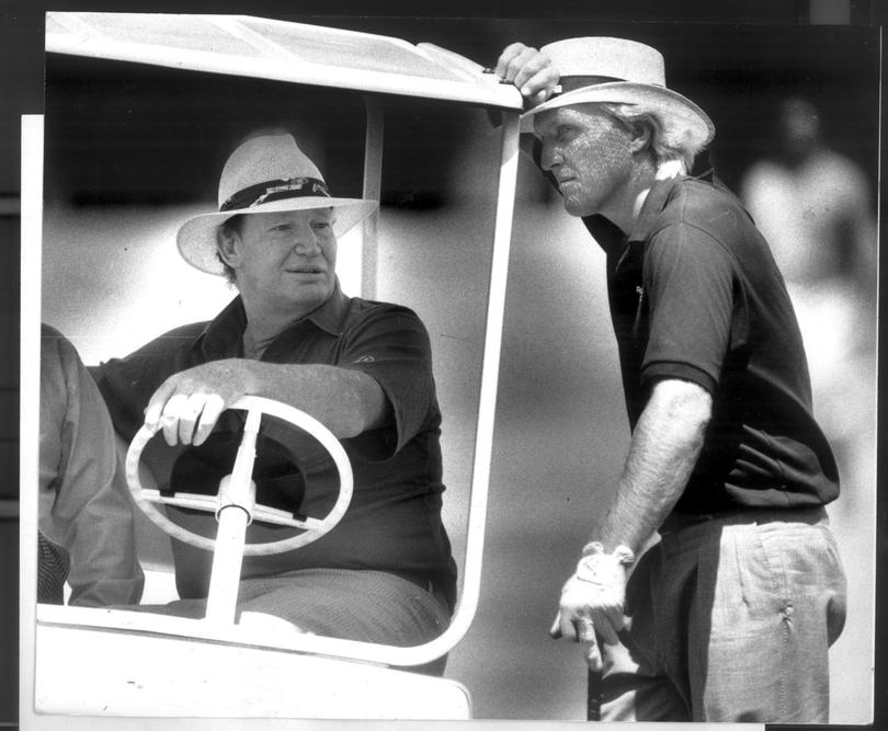 Greg Norman talks to Kerry Packer at the Australian Golf club in Kensington where players were practising for the Australian Golf Championships on 28th November 1999