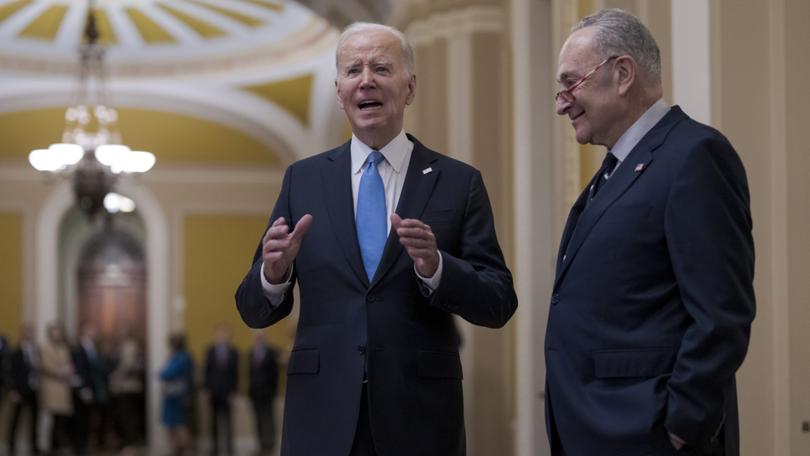 President Joe Biden, center, and Senate Majority Leader Chuck Schumer.