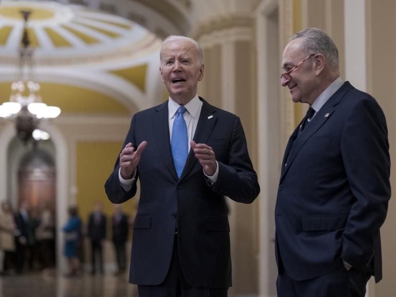 President Joe Biden, center, and Senate Majority Leader Chuck Schumer.