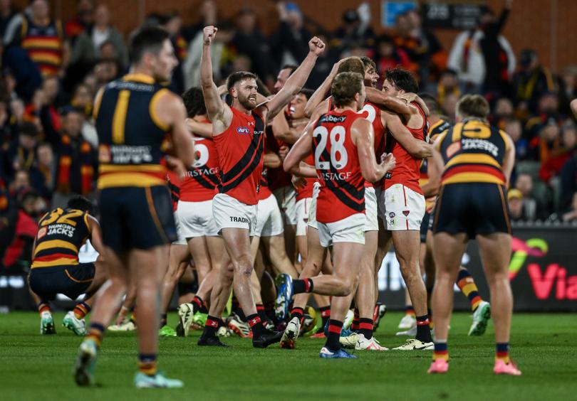 ADELAIDE, AUSTRALIA - APRIL 19: Bombers  celebrate the final siren  during the round six AFL match between Adelaide Crows and Essendon Bombers at Adelaide Oval, on April 19, 2024, in Adelaide, Australia. (Photo by Mark Brake/Getty Images)