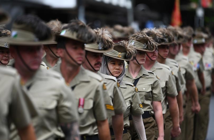 BRISBANE, AUSTRALIA - APRIL 25: Veterans and serving members of the Australian and New Zealand armed forces march during an Anzac Day parade on April 25, 2023 in Brisbane, Australia. Anzac Day is a national holiday in Australia, traditionally marked by a dawn service held during the time of the original Gallipoli landing and commemorated with ceremonies and veterans parades throughout the day. Anzac Day commemorates the day the Australian and New Zealand Army Corp (ANZAC) landed on the shores of Gallipoli on April 25, 1915, during World War I. (Photo by Dan Peled/Getty Images)