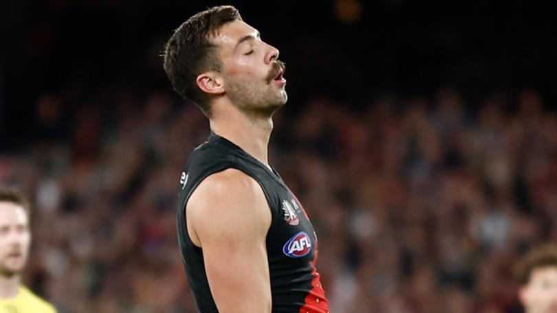 Kyle Langford of the Bombers reacts after missing a shot on goal to put the Bombers in front in the dying stages against Collingwood.