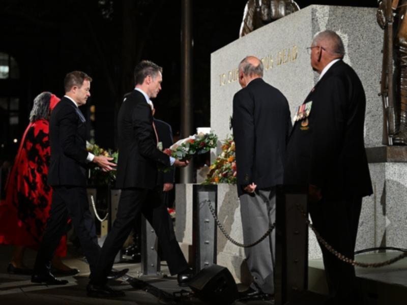 Chris Minns and Mark Speakman lay wreaths at the dawn service.