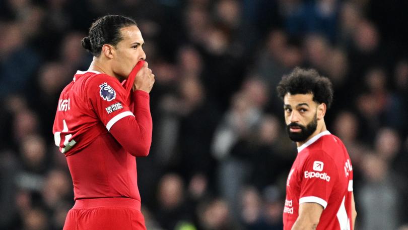 Virgil van Dijk looks dejected after the team's upset defeat.