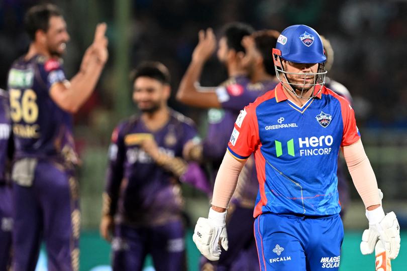 Kolkata Knight Riders' Mitchell Starc (L) celebrates with teammates after taking the wicket of Delhi Capitals' David Warner (R) during the Indian Premier League (IPL) Twenty20 cricket match between Delhi Capitals and Kolkata Knight Riders at the Y.S. Rajasekhara Reddy cricket stadium in Visakhapatnam on April 3, 2024. (Photo by Dibyangshu SARKAR / AFP) / -- IMAGE RESTRICTED TO EDITORIAL USE - STRICTLY NO COMMERCIAL USE --