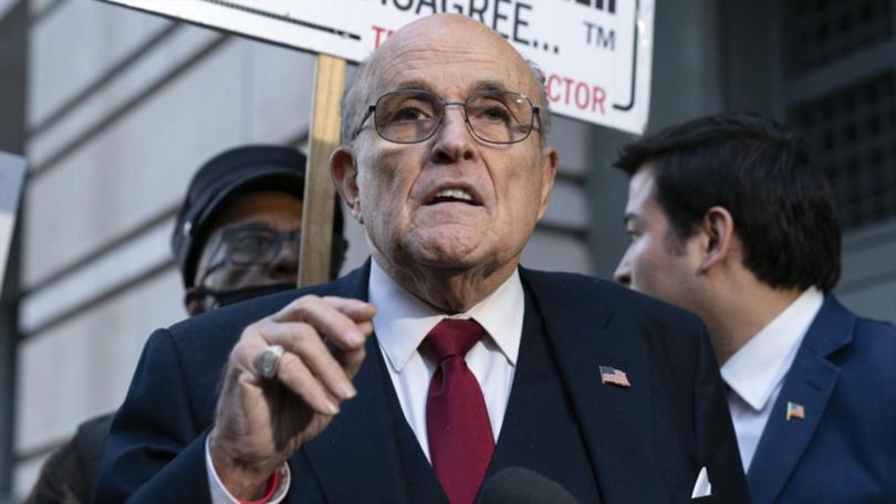 Rudy Giuliani is among 18 people charged over a fake elector plot in Arizona, while former president Donald Trump is labelled an unindicted co-conspirator.