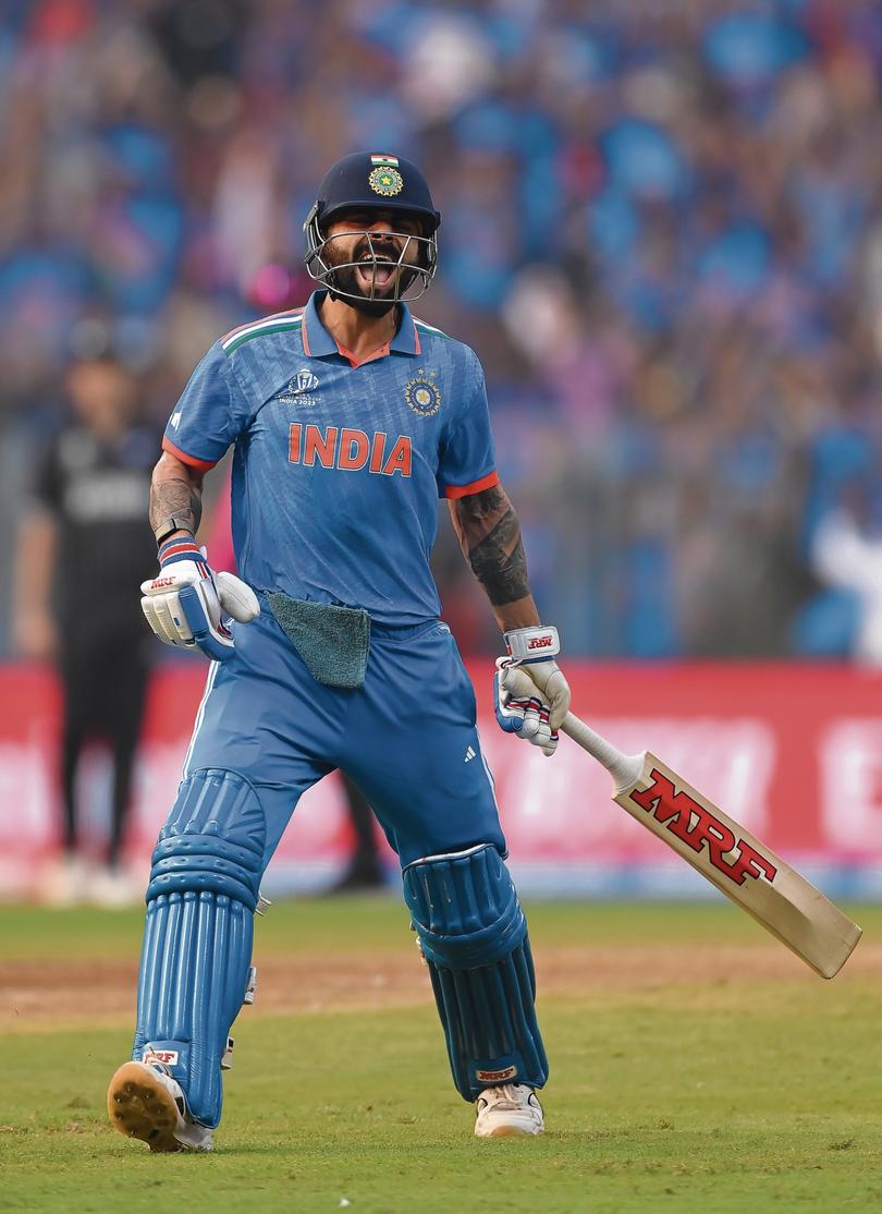 Virat Kohli of India celebrates after scoring a century, overtaking Sachin Tendulkar for the all-time most ODI centuries during the ICC Men's Cricket World Cup India 2023 Semi Final match between India and New Zealand at Wankhede Stadium on November 15, 2023 in Mumbai, India. 