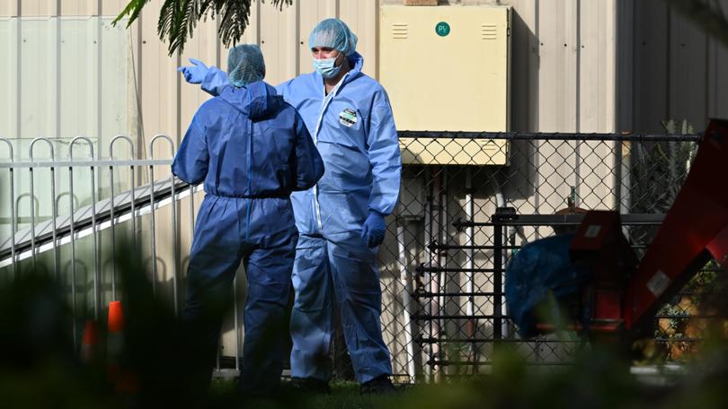 Police are combing the scene at the home in Burpengary East for clues.