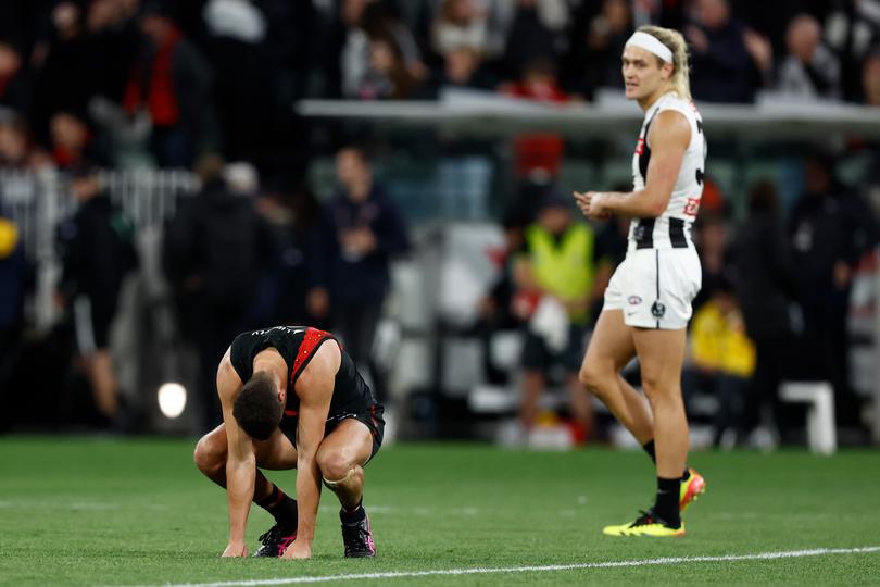 MELBOURNE, AUSTRALIA - APRIL 25: Kyle Langford of the Bombers looks dejected after a draw during the 2024 AFL Round 07 match between the Essendon Bombers and the Collingwood Magpies at the Melbourne Cricket Ground on April 25, 2024 in Melbourne, Australia. (Photo by Michael Willson/AFL Photos via Getty Images)