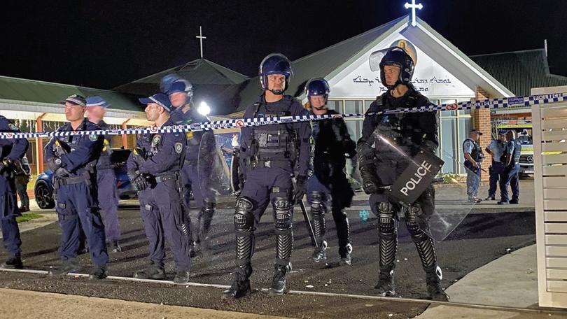 Riot police outside the Wakeley church.