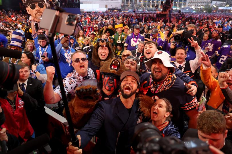 DETROIT, MICHIGAN - APRIL 25: Caleb Williams celebrates with fans after being selected first overall by the Chicago Bears during the first round of the 2024 NFL Draft at Campus Martius Park and Hart Plaza on April 25, 2024 in Detroit, Michigan. (Photo by Gregory Shamus/Getty Images)