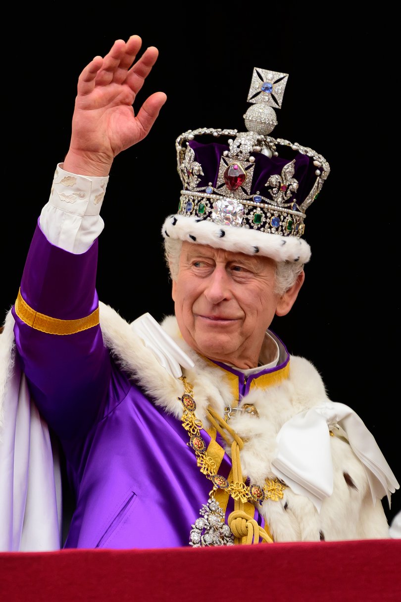 LONDON, ENGLAND - MAY 06: King Charles II waves from the balcony of Buckingham Palace following the Coronation of King Charles III and Queen Camilla on May 06, 2023 in London, England. The Coronation of Charles III and his wife, Camilla, as King and Queen of the United Kingdom of Great Britain and Northern Ireland, and the other Commonwealth realms takes place at Westminster Abbey today. Charles acceded to the throne on 8 September 2022, upon the death of his mother, Elizabeth II.  (Photo by Leon Neal/Getty Images)