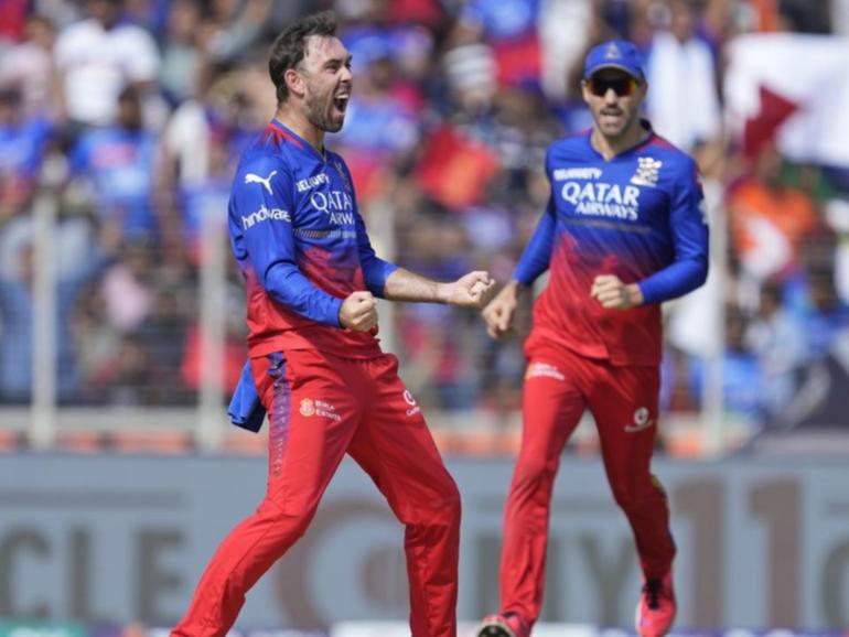 Glenn Maxwell roars after taking a wicket with his fourth ball on his return to IPL action. (AP PHOTO)