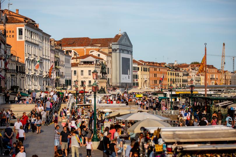 Venice Venice took action on overtourism, introducing a 5€ (AUD$8) fee to day trippers who want to access the city