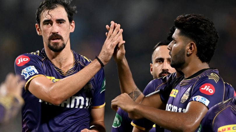 Mitchell Starc is congratulated by his Kolkata teammates for dismissing Jake Fraser-McGurk.