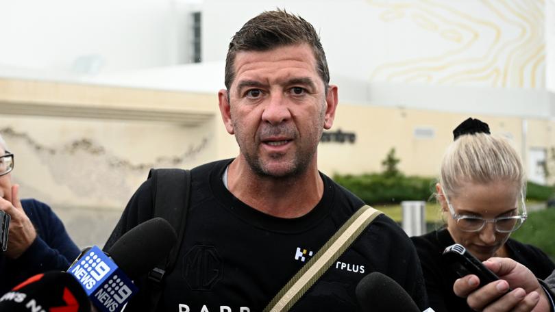 Rabbitohs head coach Jason Demetriou is surrounded by media as he leaves Rabbitohs headquarters on Tuesday.