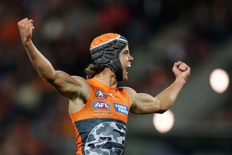 CANBERRA, AUSTRALIA - APRIL 25: Darcy Jones of the Giants celebrates a goal during the round seven AFL match between Greater Western Sydney Giants and Brisbane Lions at Manuka Oval on April 25, 2024 in Canberra, Australia. (Photo by Jason McCawley/AFL Photos/via Getty Images )