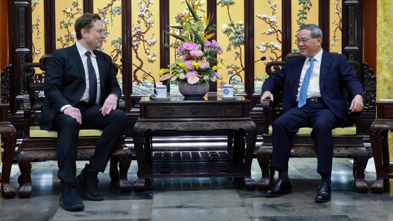 Tesla chief Elon Musk meets with Chinese Premier Li Qiang in Beijing on Sunday. 