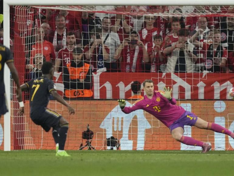 Real Madrid's Vinicius Junior (second left) scores from the penalty spot against Bayern Munich. (AP PHOTO)