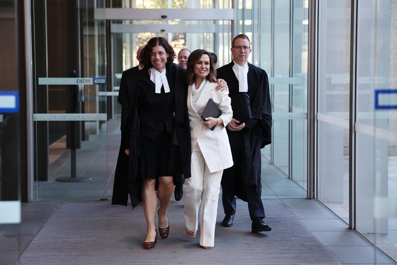 SYDNEY, AUSTRALIA - APRIL 15: Sue Chrysanthou SC hugs Lisa Wilkinson as they emerge from court on April 15, 2024 in Sydney, Australia. Justice Michael Lee has ruled in favour of Network Ten and journalist Lisa Wilkinson in Bruce Lehrmann's defamation case. The case arose from allegations aired on 'The Project' news program, in which Brittany Higgins claimed she was raped by a colleague in Parliament House. Lehrmann, who denied any sexual contact with Ms Higgins, alleged defamation by the broadcast, despite not being explicitly named. The court found that Lehrmann had raped Brittany Higgins on the balance of probabilities.  (Photo by Don Arnold/Getty Images)