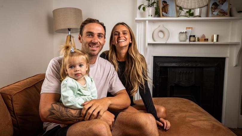 Port Adelaide star Jeremy Finlayson, his wife Kellie and their daughter Sophia. Tom Huntley