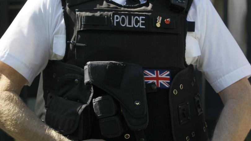 A UK police officer has been charged after he allegedly published an image in support of Hamas. (AP PHOTO)