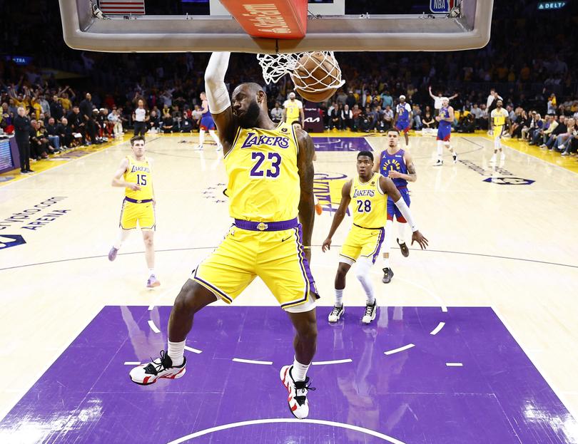 LOS ANGELES, CALIFORNIA - APRIL 25:  LeBron James #23 of the Los Angeles Lakers makes a slam dunk against the Denver Nuggets in the first quarter during game three of the Western Conference First Round Playoffs at Crypto.com Arena on April 25, 2024 in Los Angeles, California.  (Photo by Ronald Martinez/Getty Images)