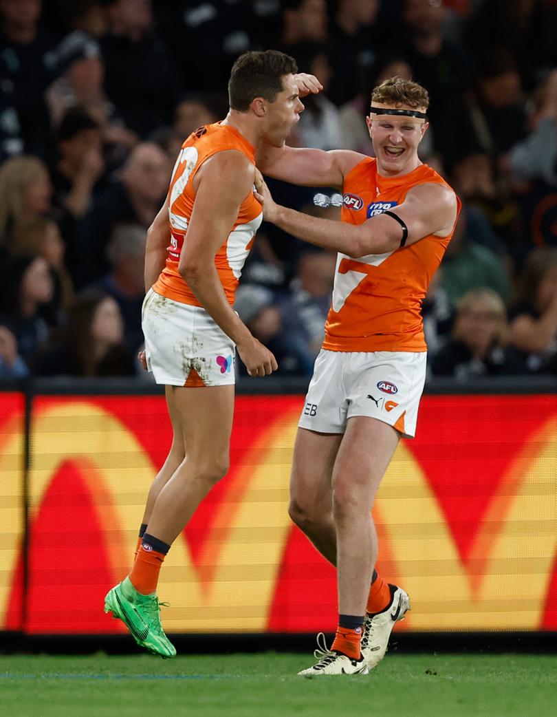 MELBOURNE, AUSTRALIA - APRIL 20: Josh Kelly (left) and Tom Green of the Giants celebrate during the 2024 AFL Round 06 match between the Carlton Blues and the GWS GIANTS at Marvel Stadium on April 20, 2024 in Melbourne, Australia. (Photo by Michael Willson/AFL Photos via Getty Images)
