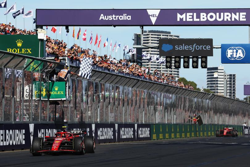 MELBOURNE, AUSTRALIA - MARCH 24: Race winner Carlos Sainz of Spain driving (55) the Ferrari SF-24 takes the chequered flag during the F1 Grand Prix of Australia at Albert Park Circuit on March 24, 2024 in Melbourne, Australia. (Photo by Robert Cianflone/Getty Images) *** BESTPIX ***