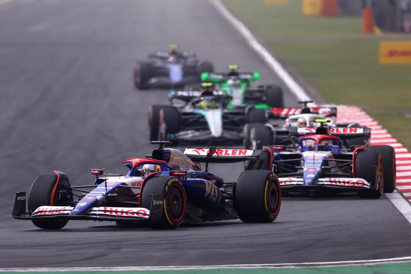 SHANGHAI, CHINA - APRIL 21: Daniel Ricciardo of Australia driving the (3) Visa Cash App RB VCARB 01 leads Yuki Tsunoda of Japan driving the (22) Visa Cash App RB VCARB 01 during the F1 Grand Prix of China at Shanghai International Circuit on April 21, 2024 in Shanghai, China. (Photo by Lars Baron/Getty Images)