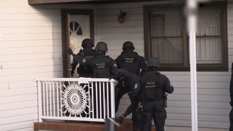 Detectives raided a property in the suburb of Fairfield at about 4.20pm on Thursday. Officers arrested a 46-year-old man and have taken him to Fairfield Police Station where he will likely be charged with blackmail.