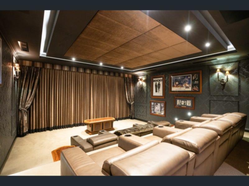 The home theatre at the Applecross mansion comes complete with nine leather reclining chairs and remote controlled cinema curtains.