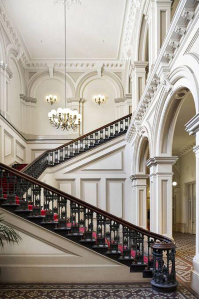 The building's design borrows from Italian architecture and its common areas feature grand staircases.