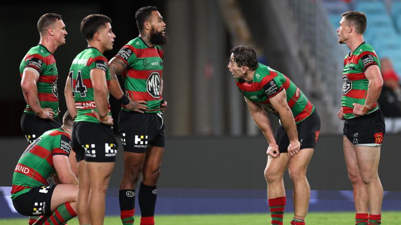 Rabbitohs players react after a Panthers try.
