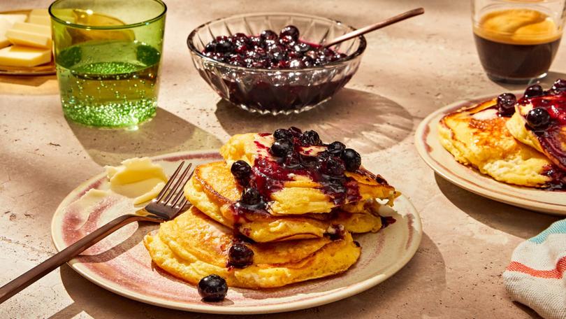 Lemon ricotta pancakes in New York, Jan. 11, 2022. Genevieve Ko whips ricotta into the batter and skips the stiff egg whites for a recipe thats as effortless as it is comforting. Food styled by Susie Theodorou. Props styled by Paige Hicks. (Jenny Huang/The New York Times)