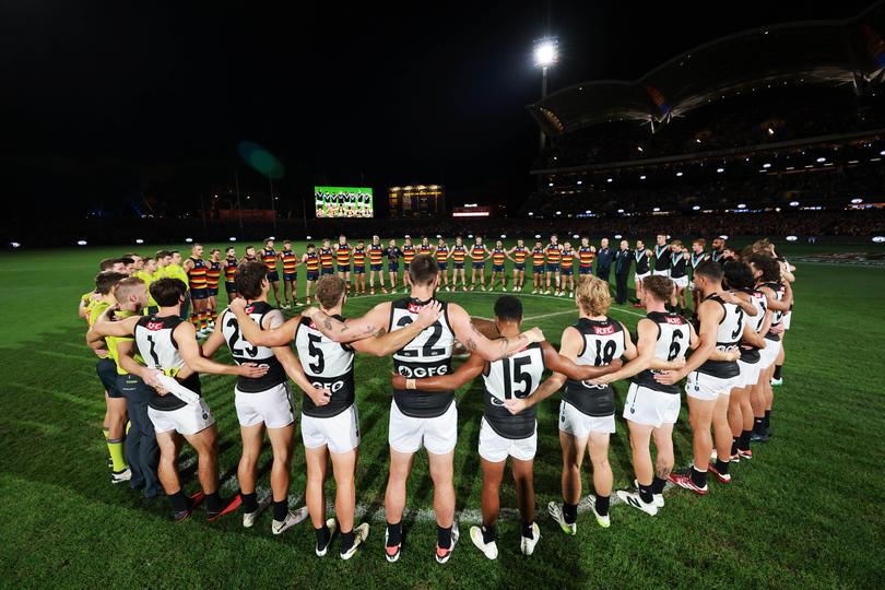 A moment of silence for gender-based violence during the 2024 AFL Round 08 match between the Adelaide Crows and the Port Adelaide.