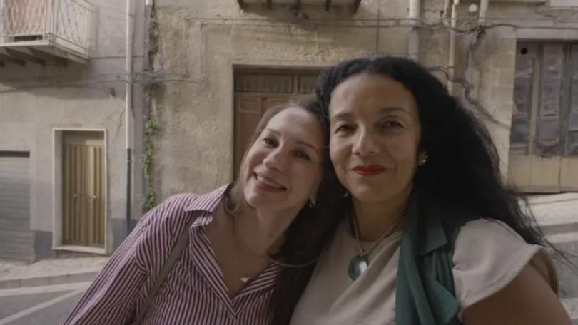 Socializing is big in Mussomeli, and Rubia Daniels says she made fast friends with Katerina Montagnino (left), a resident who is now like a sister to her.