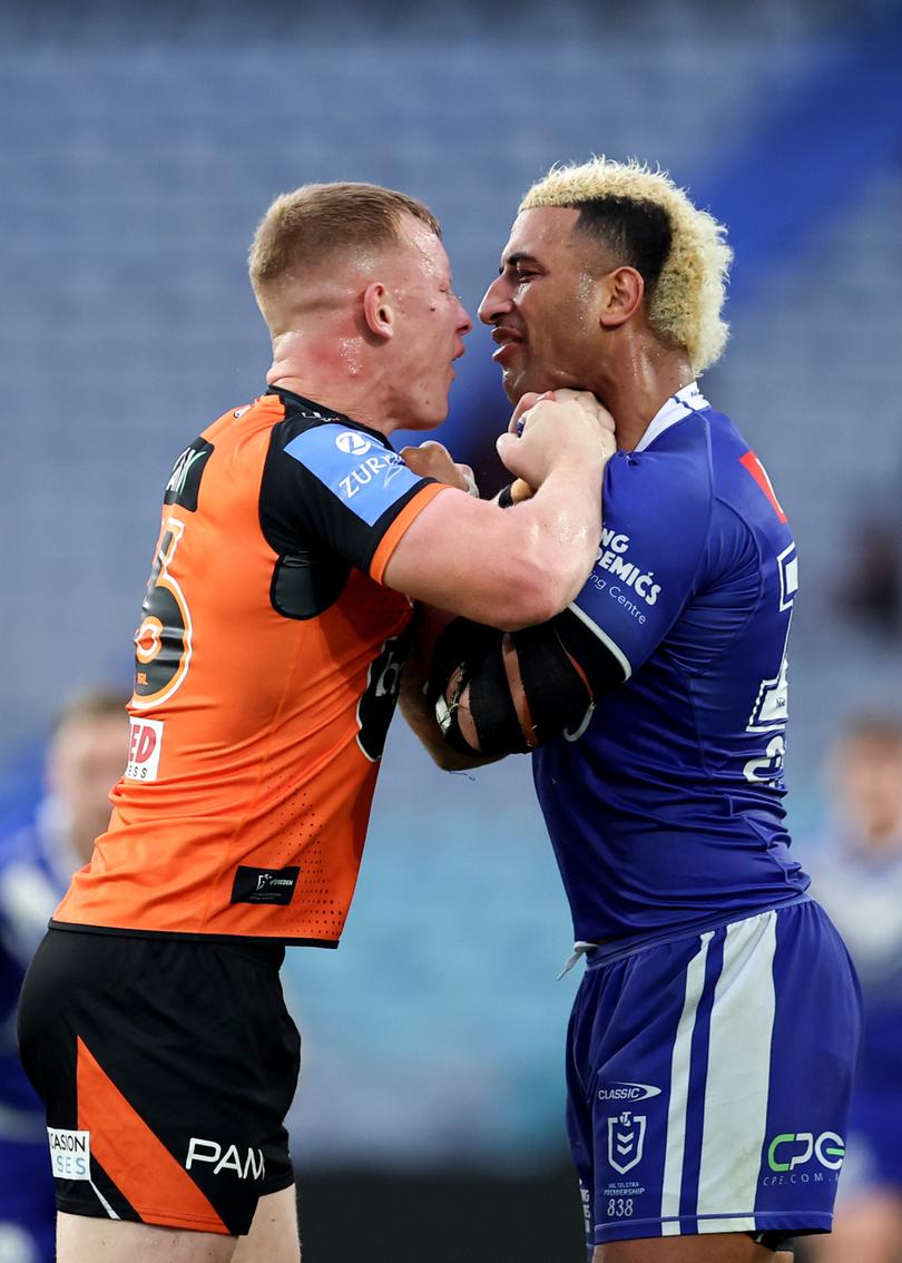 SYDNEY, AUSTRALIA - MAY 04: Viliame Kikau of the Bulldogs clashes with Alex Seyfarth of the Tigers during the round nine NRL match between Canterbury Bulldogs and Wests Tigers at Accor Stadium, on May 04, 2024, in Sydney, Australia. (Photo by Brendon Thorne/Getty Images)