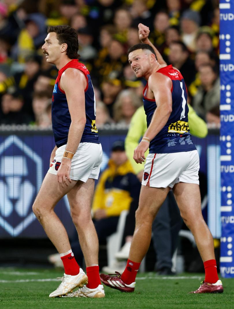 MELBOURNE, AUSTRALIA - APRIL 24: Jake Lever (left) and Steven May of the Demons share a discussion during the 2024 AFL Round 07 match between the Richmond Tigers and the Melbourne Demons at the Melbourne Cricket Ground on April 24, 2024 in Melbourne, Australia. (Photo by Michael Willson/AFL Photos via Getty Images)