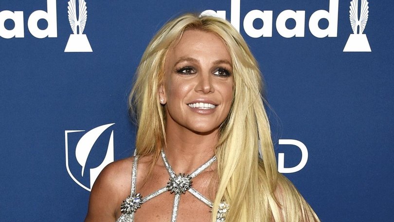 Pop singer Britney Spears says she injured her foot and denies reports of having a breakdown. (AP PHOTO)