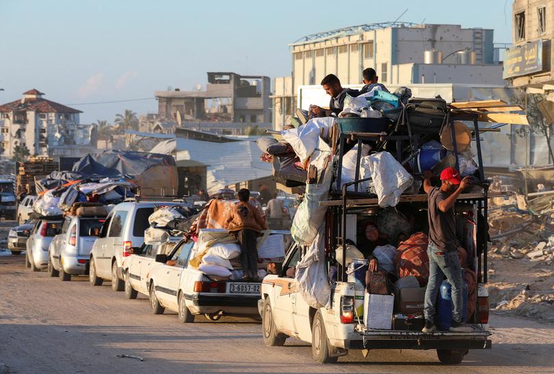 Displaced Palestinians, who fled Rafah, arrive in Khan Younis.