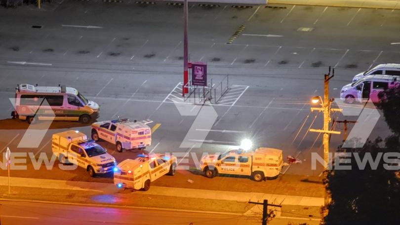 Police at the scene of the stabbing on Saturday night.